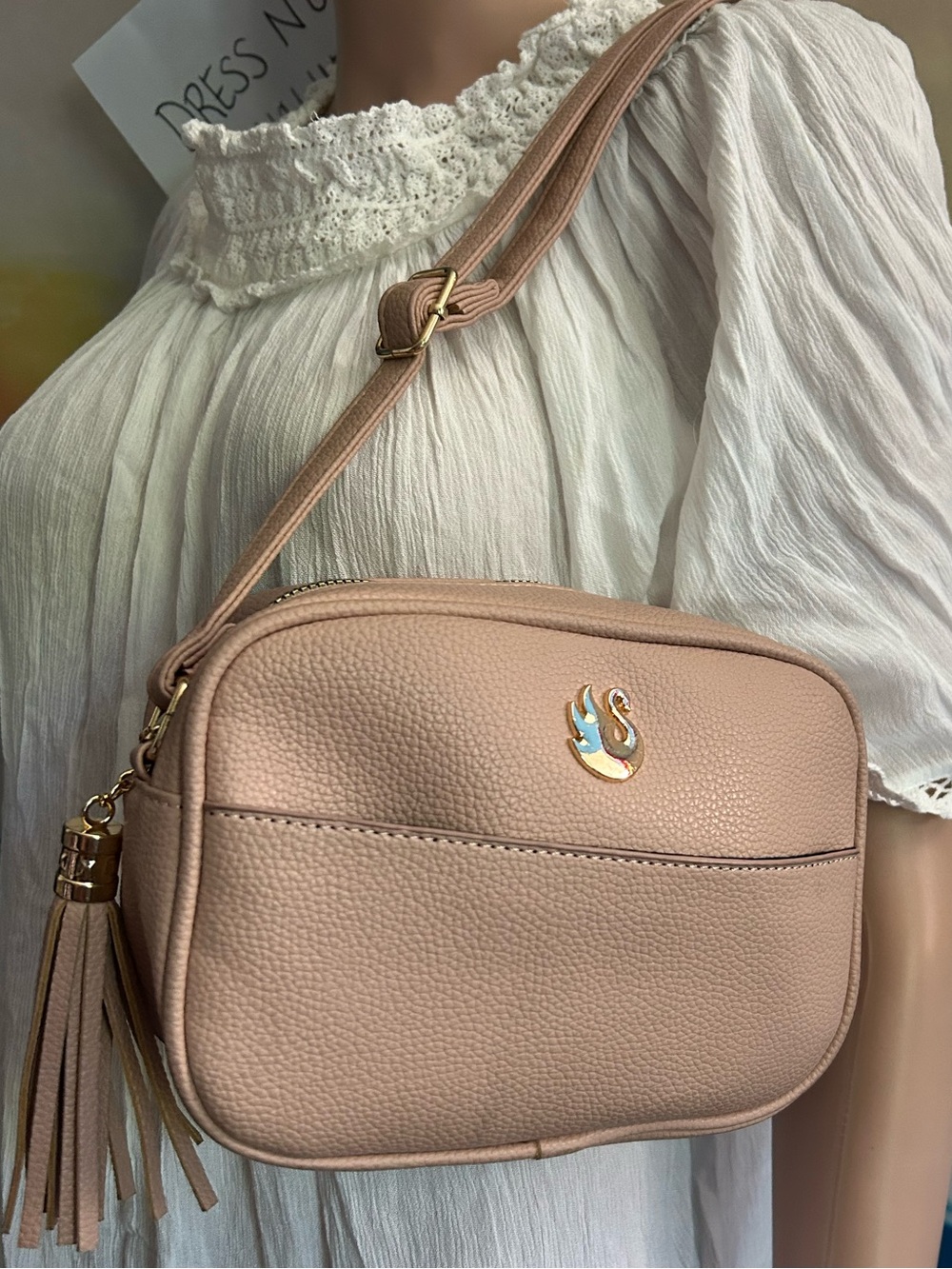 Gloria Vanderbilt Women’s Light Pink Pebbled Faux Leather Crossbody Bag Tassel